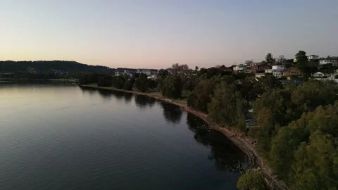 Drone flyover lake at sunset Stock Footage 209863866