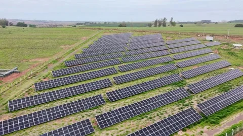 Drone Flyover of Medium-Sized Solar Power Plant in Rural Area Stock Footage 318992552