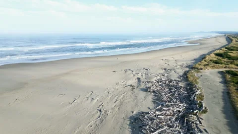 Drone flyover Oregon beach durring the day Stock Footage 251756336