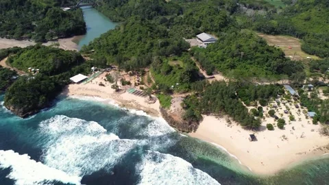 Drone Flyover Passing Two Small Islands Toward Tropical Beach, Java, Indonesia Stock Footage 310219794
