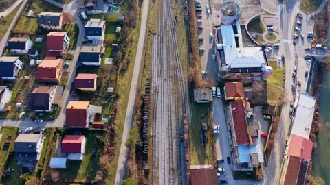 Drone flyover railway line through town Stock Footage 330429231