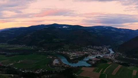 Drone flyover river town at sunset 스톡 동영상 331867245