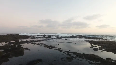 Drone Flyover Rocks and Ocean Stock Footage 86657341