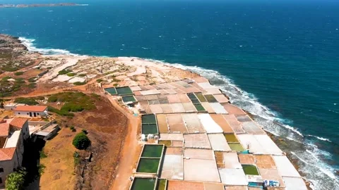 Drone Flyover of Salt Evaporation Ponds on Mediterranean Coast in Anfeh, Lebanon Stock Footage 329225014
