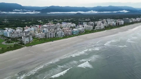 Drone Flyover of Sandy Beach, Beachfront Buildings and Misty Mountains, Brazil Vídeos de archivo 334614285