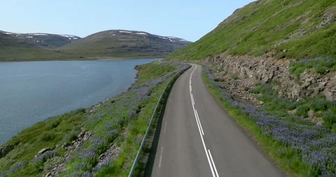 Drone Flyover of Scenic Coastal Road by Fjord Mountain in Iceland 스톡 동영상 334419084