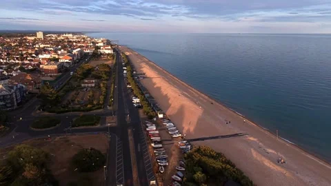 Drone Flyover Of Seaside Town And Beach At Sunset Stock Footage 341865409