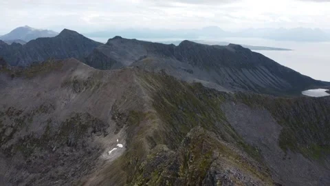 Drone flyover of Sjursviktindan mountain summit Stock Footage 340511534