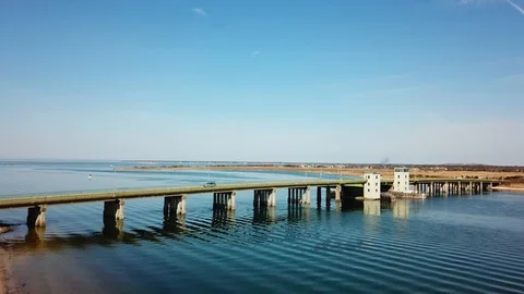 Drone flyover Smith Point Bridge cars bicycle seagull Stock Footage 106043162