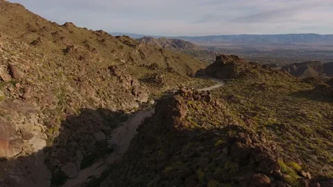 Drone Flyover Toward Rugged Mountain in California Desert Springtime Stock Footage 146755557