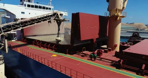 Drone flyover of unidentified bulk grain ship loading grain - 4K 30P. 스톡 동영상 86596536