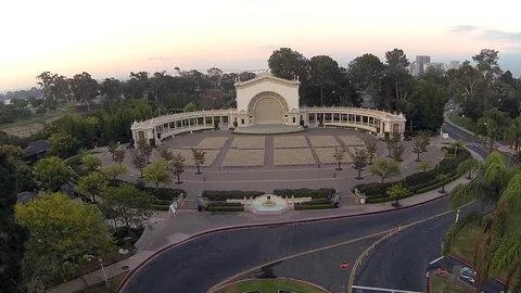 Drone flyover urban park with performance pavilion and colonial architecture. Stock Footage 129061313