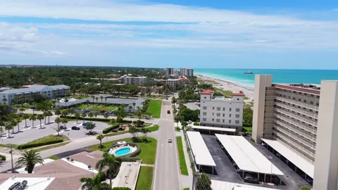 Drone Flyover Of Venice Florida Hotels Palm Trees And Coastal Road Stock Footage 339297780