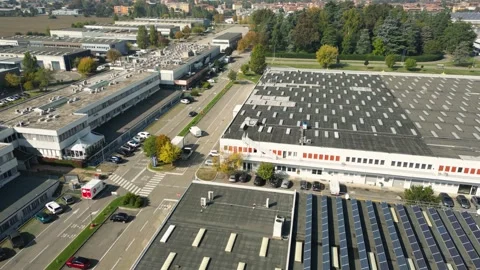 Drone flyover of warehouse and parking area near Bologna, Italy Stock Footage 335514915