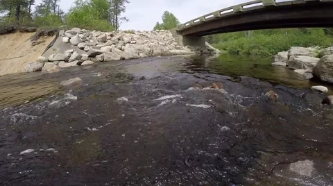 Drone flys above bridge with stream (aerial) Stock Footage 51735396