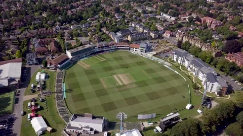 Drone flys and pans down over cricket ground Stock Footage 136218478