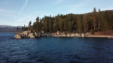 Drone flys away from lake beach Stock Footage 83229285