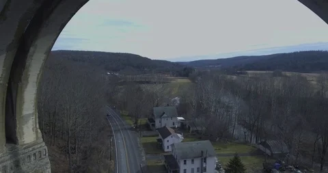 Drone Flys Backwards Through Viaduct With Warp Speed Stock Footage 98955231