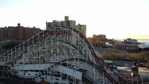 Drone flys to close up of Cyclone Roller Coaster sign Stock Footage 129759894