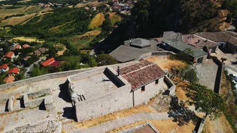 Drone flys by a guy who stands on the wall and enjoys a fantastic view Stock Footage 159061535