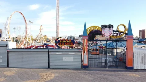 Drone flys over gate to Coney Island Luna PArk Video stock 129768470