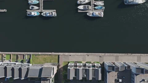 Drone Flys over Marina Homes revealing aligned Boats [4K] Stock Footage 335820313
