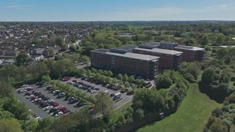 Drone flys over park, office building &amp; suburban landscape [4K] Stock Footage 335820747