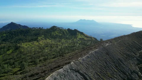 Drone Flys Over Rocky Volcano Crater Rim Kawah Ijen Java Indonesia Bright Stockbeeldmateriaal 327799140