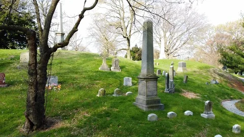Drone flys past gothic grave marker Greenwood Cemetery Stock Footage 129276578