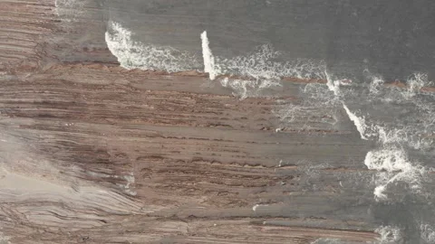 Drone flysch sea stack rock lines formation beach stones Stock Footage 221572438