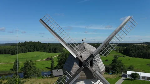 Drone Flythrough Between Windmill Sails Above White Stork on Historic Windmill Stock Footage 340649376