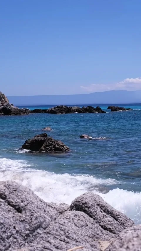 Drone on the foaming waves around the rocks on the shores of the sea lagoon Stock Footage 278968200