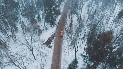 Drone following a car at Eagle Lake on a cold winter day, Canada Stock Footage 99990679