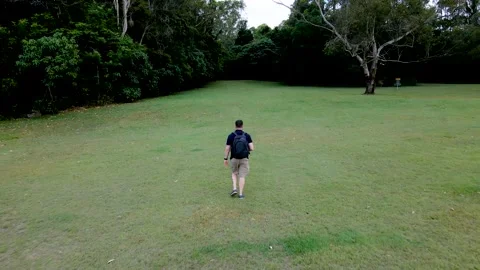 Drone following operator in park Stockbeeldmateriaal 167146625