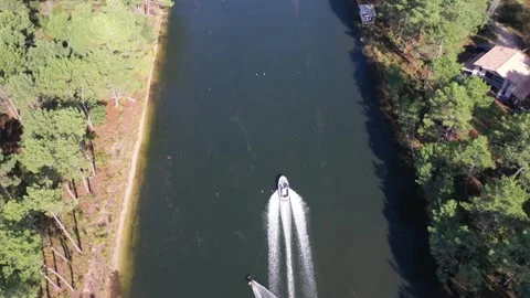 Drone following water skier behind a boat Stock Footage