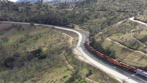 Drone follows a BNSF Train in Tehachapi Loop California Stock Footage 122973591