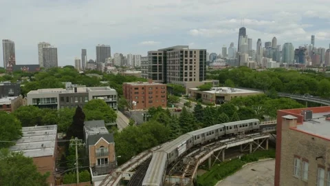 Drone Follows Subway Around Elevated Tracks to Reveal Chicago Skyline Stock Footage 132532561