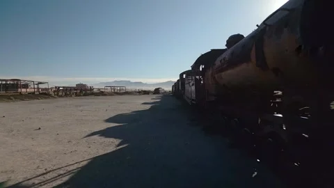 Drone footage of abandoned train graveyard in desert Stock Footage 314671561