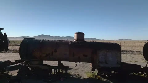 Drone footage of abandoned train graveyard in desert Stock Footage 314671663