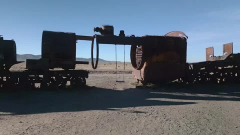 Drone footage of abandoned train graveyard in desert Stock Footage 314671774