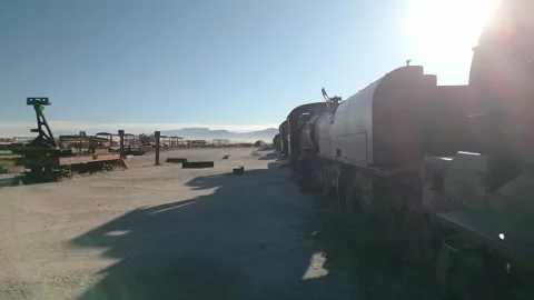 Drone footage of abandoned train graveyard in desert Stock Footage 314746536