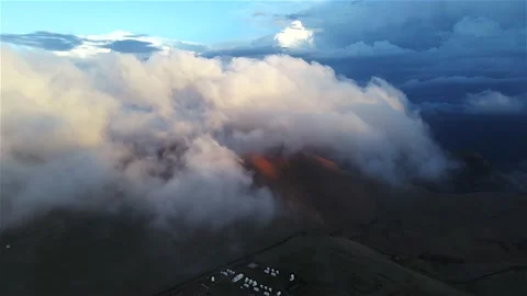 Drone footage above the clouds. Huge fluffy clouds at sunset in the highlands. Stock Footage 153644933