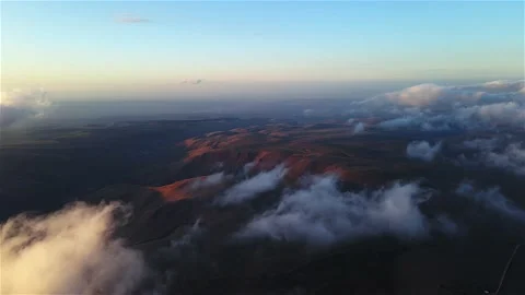 Drone footage above the clouds. Huge fluffy clouds at sunset in the highlands. Stock Footage 153644980