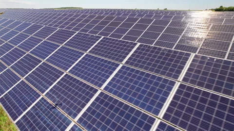 Drone footage across solar modules in bright daylight Stock Footage 346545486