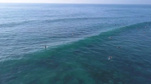 Drone footage of Big Wave rolling in on surfers - Del Mar, San Diego, CA Stock-Footage 88256606