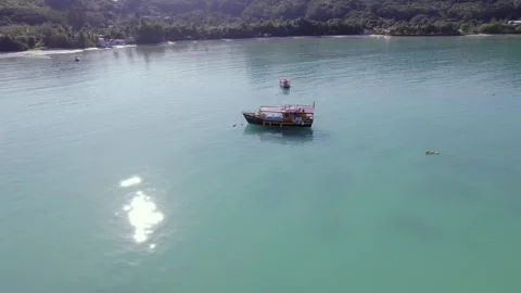 Drone footage of bird eye view of tracking docking boats, calm ocean Stock Footage 320669884