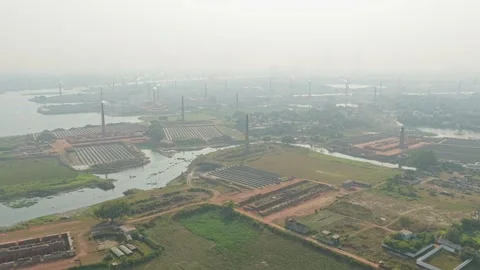 Drone footage of brick field smoke and workers in Bangladesh Stock Footage 325371653
