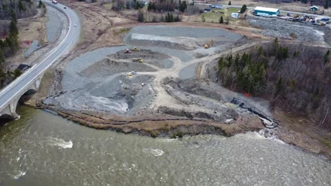 Drone Footage of Bridge Construction During Spring Flood in Gaspesie Stock Footage 334635694