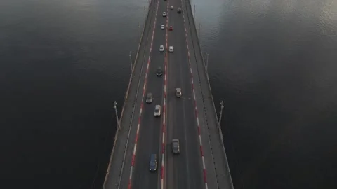 Drone footage of a bridge over Dnipro with traffic and Motherland monument Stock Footage 166283536