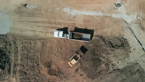 Drone footage. A bulldozer levels a plot of land for construction development Stock Footage 239092558